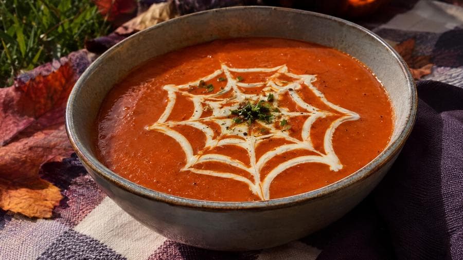 Spooky-Cute Smoky Spiderweb Tomato Soup